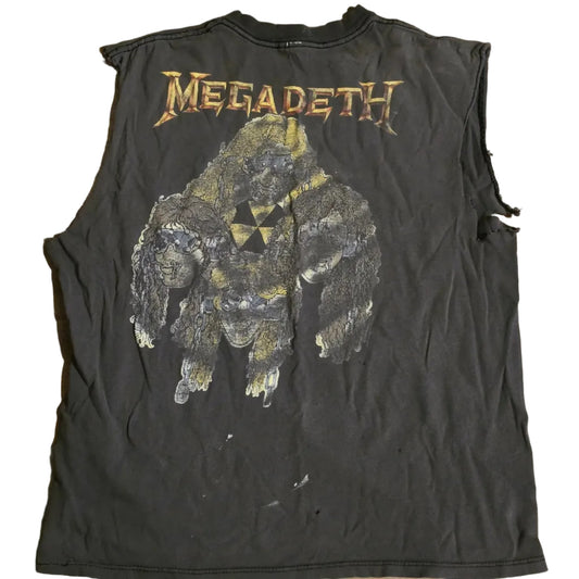 Black sleeveless shirt with Megadeth logo and graphic design on a wooden surface