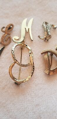 Lot of 7 Letter Brooches