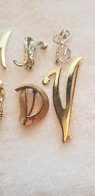 Lot of 7 Letter Brooches