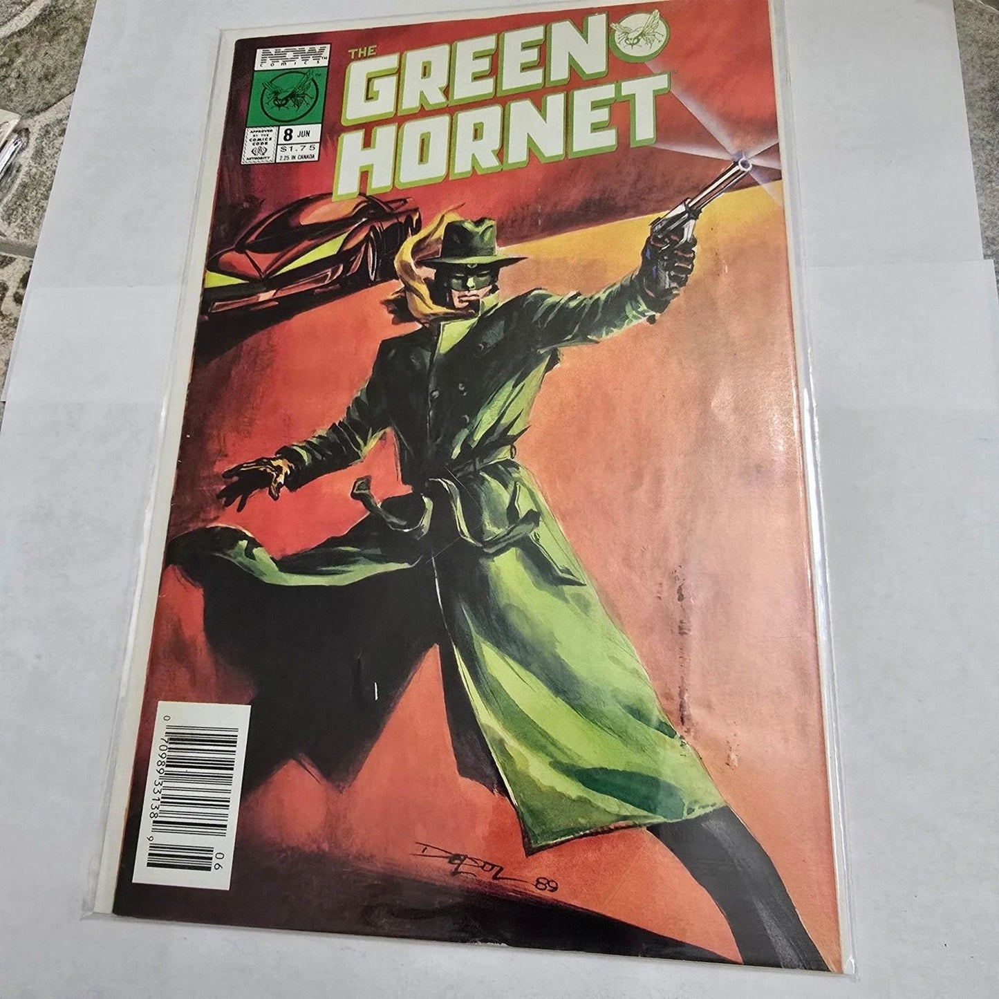 Comic book cover featuring The Green Hornet with a red background