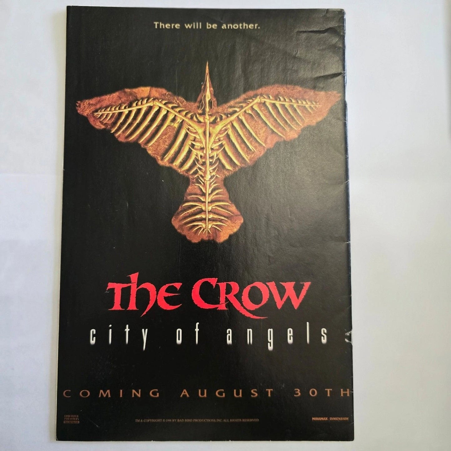 Promotional poster for 'The Crow: City of Angels' with a stylized crow design on a black background.