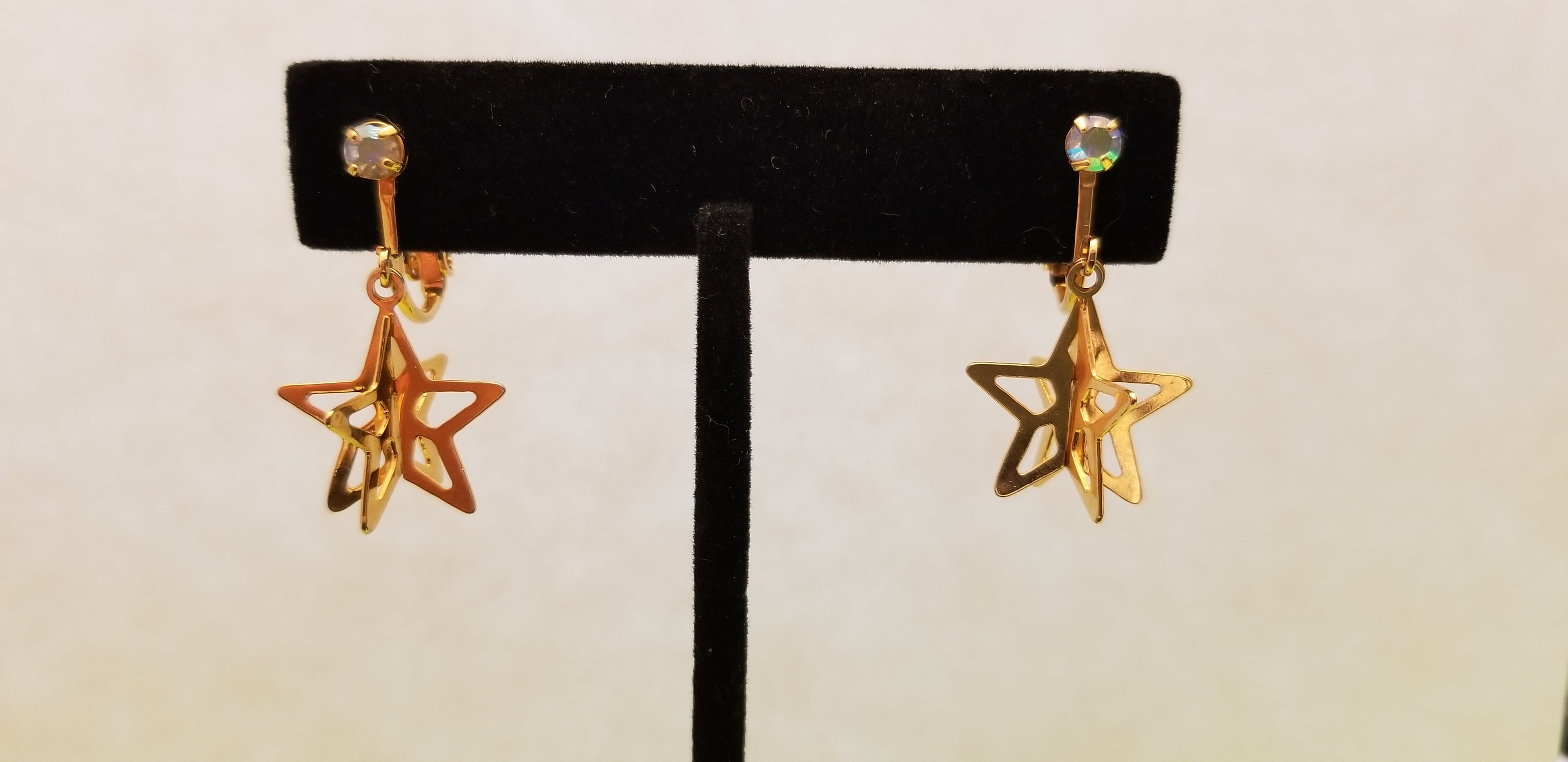 Gold Tone Star Dangle Earrings