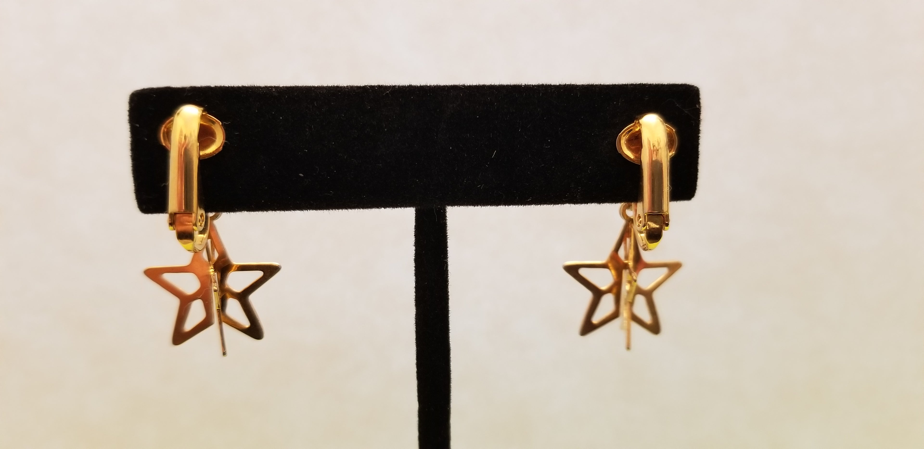 Gold Tone Star Dangle Earrings