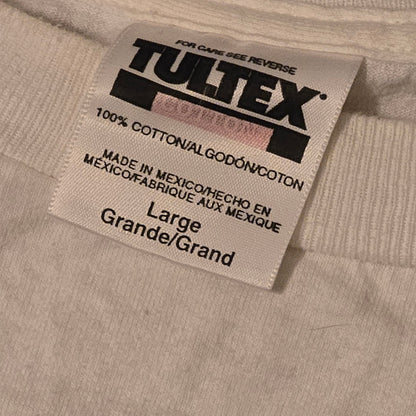 Close-up of Tultex clothing tag on vintage 1994 Megadeth T-shirt, 100% cotton, made in Mexico, size large