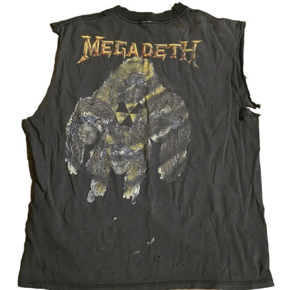Black sleeveless shirt with Megadeth logo and graphic design on a wooden surface