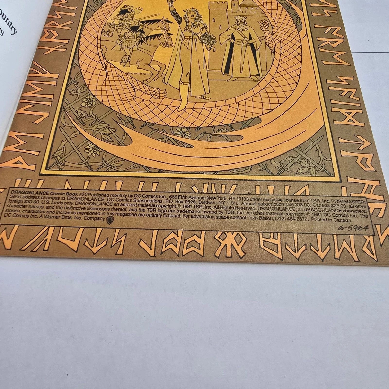 Decorative gold and black board with intricate designs and text on a white background