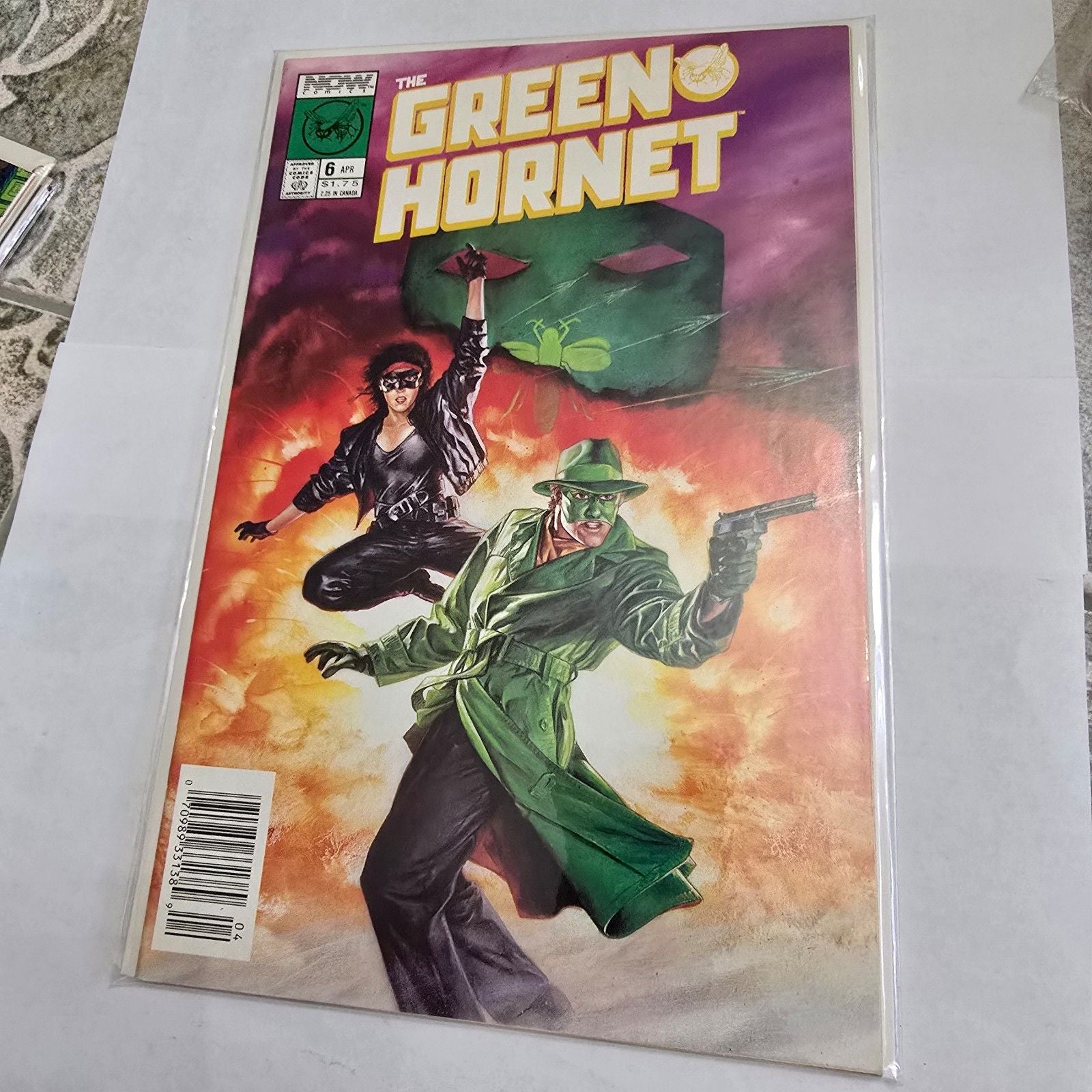 Comic book cover featuring 'The Green Hornet' with a colorful background
