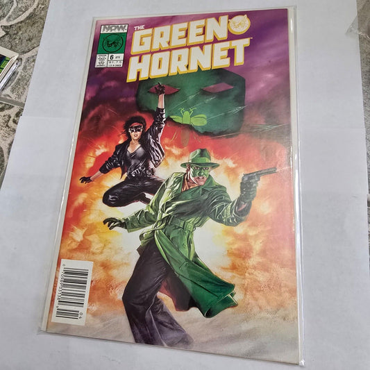 Comic book cover featuring 'The Green Hornet' with a colorful background
