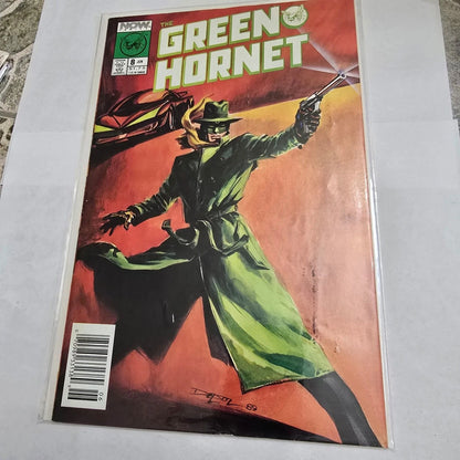 Comic book cover featuring The Green Hornet with a red background