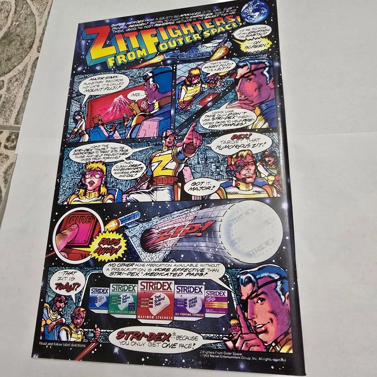 Comic-style advertisement for Striderex with space-themed graphics on a flat surface.
