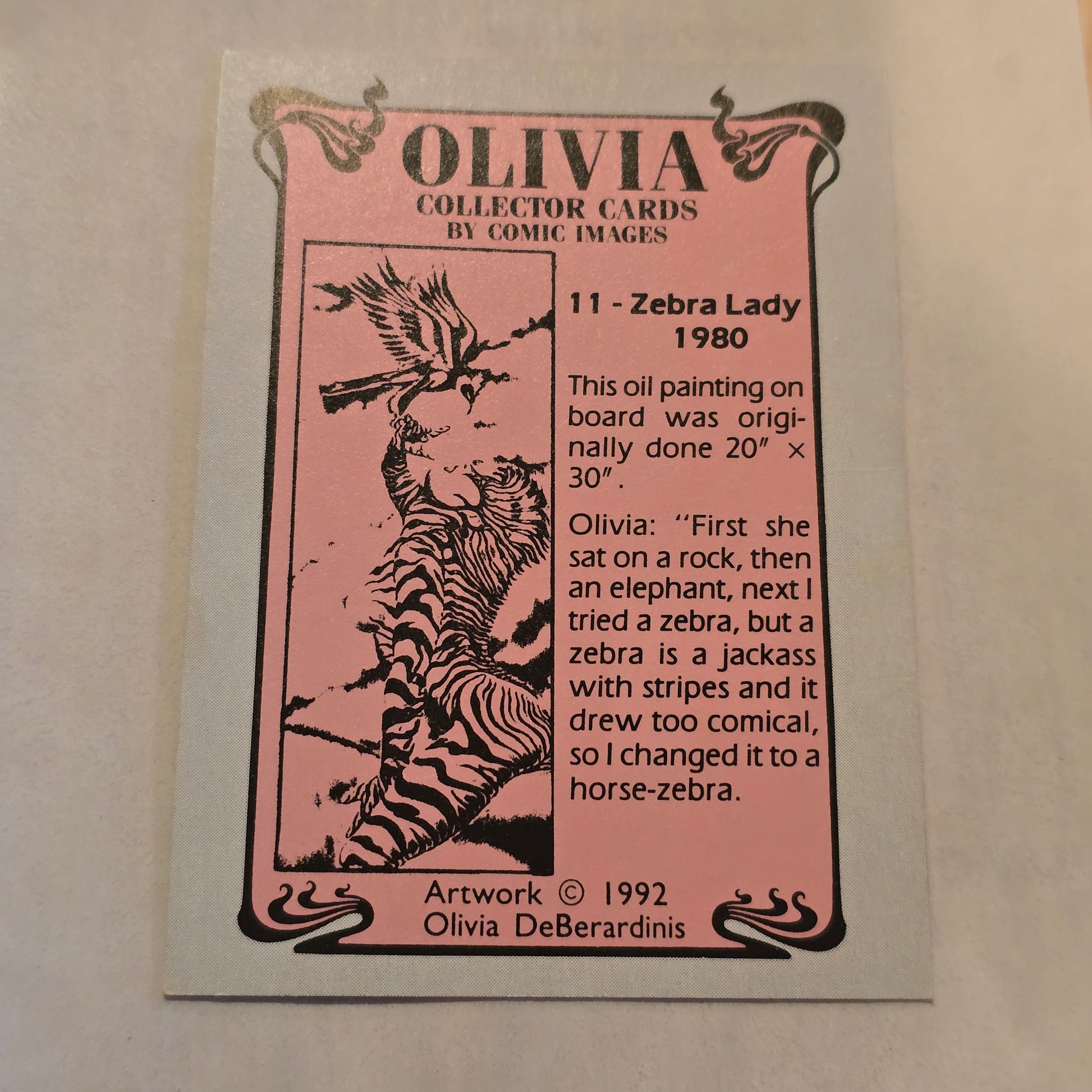 Olivia collector card with zebra illustration on a pink background