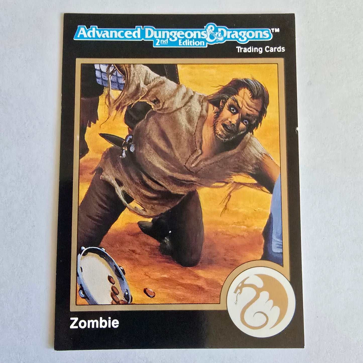 Trading card featuring a zombie character with Advanced Dungeons & Dragons branding on a light gray background.