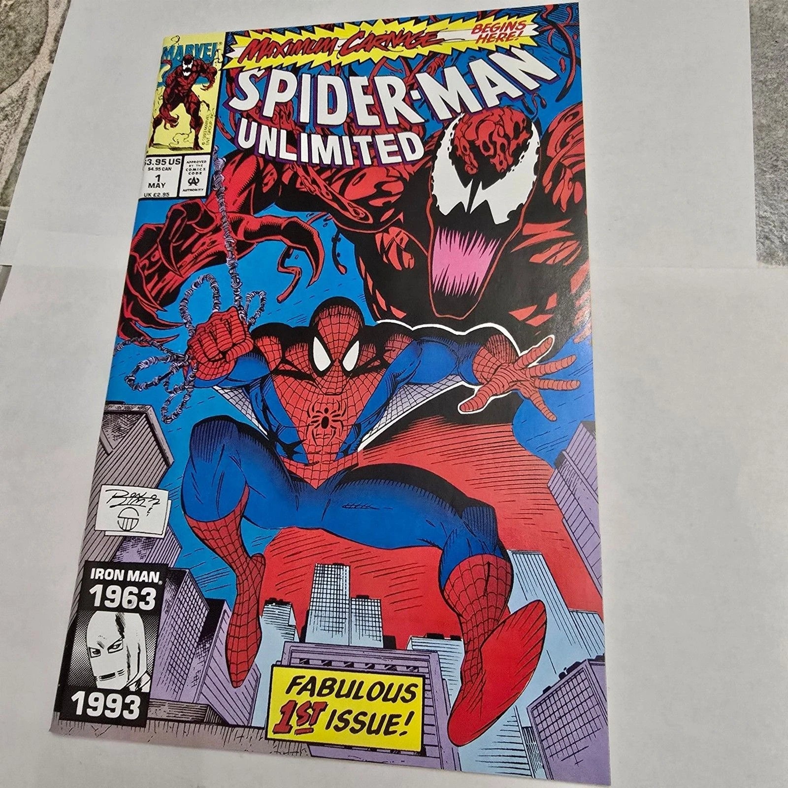 Comic book cover featuring Spider-Man and Venom with text and graphics on a gray background