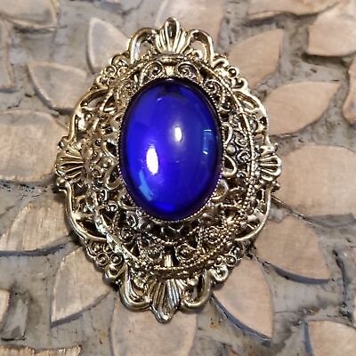 Gold Tone Blue Cabochon Filigree Brooch
